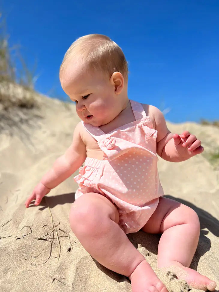 pink polka dot onesie lifestyle